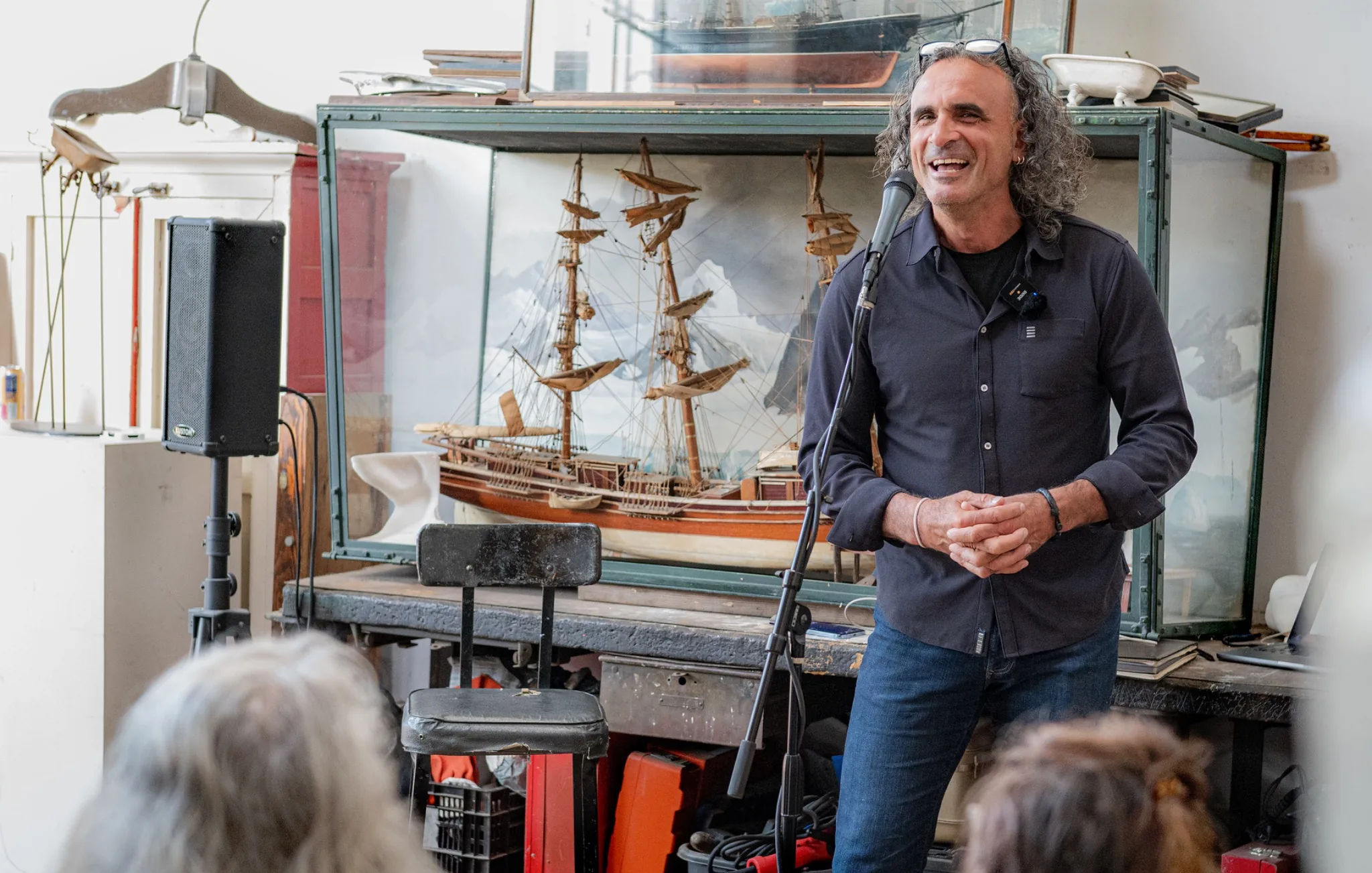 Marc Hors speaking to an audience during a photographic storytelling presentation.
