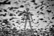 The Man, a 40-foot wooden effigy and the symbolic heart of the Burning Man festival, stands eerily reflected in pools of water and mud across the Black Rock Desert. Following an unprecedented storm during the 2023 event, over half an inch of rain fell within 24 hours—transforming the normally bone-dry playa into a surreal, mirrored landscape. Stranded vehicles, soaked camps, and silent moments replaced the usual dust and fire, offering a haunting yet beautiful twist on a celebration of impermanence, community, and radical self-expression.
